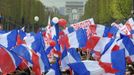 Supporters of France's President and UMP party candidate for the 2012 French presidential elections Sarkozy wave French flags at a political rally on the place de la Concorde in Paris