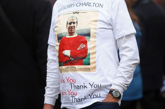 Soccer Football - Funeral of former England and Manchester United footballer Bobby Charlton - Manchester Cathedral, Manchester, Britain - November 13, 2023 Fan with an im