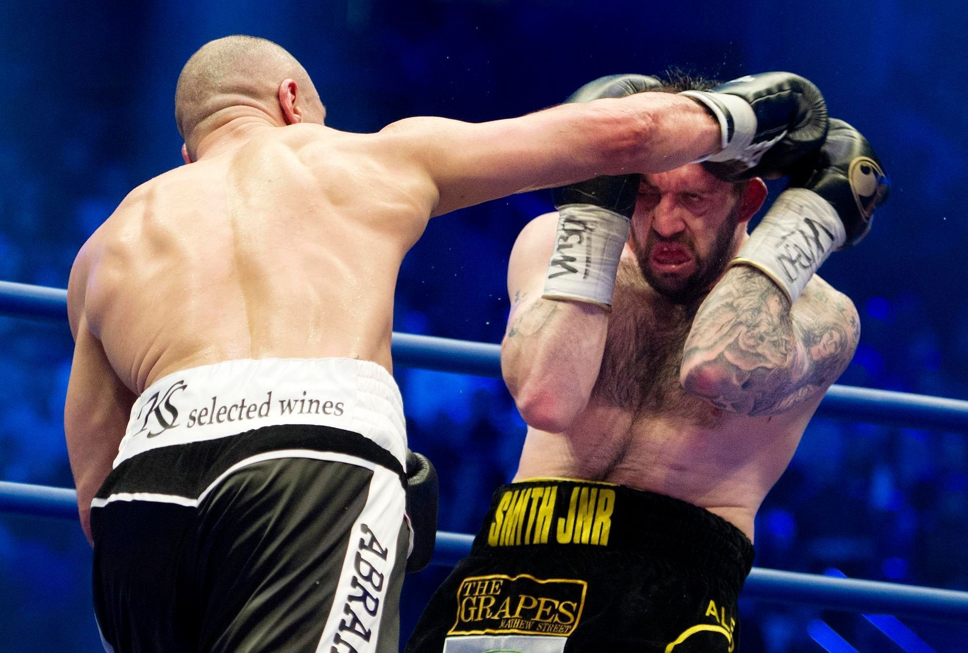 German WBO super-middleweight boxer, Arthur Abraham (L), exchanges punches with his challenger, Britain's Paul Smith, during their title fight in Berlin