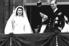 Princess Elizabeth, left, and her husband Prince Philip, wave from the balcony of London's Buckingham Palace, following their wedding, November 20, 1947