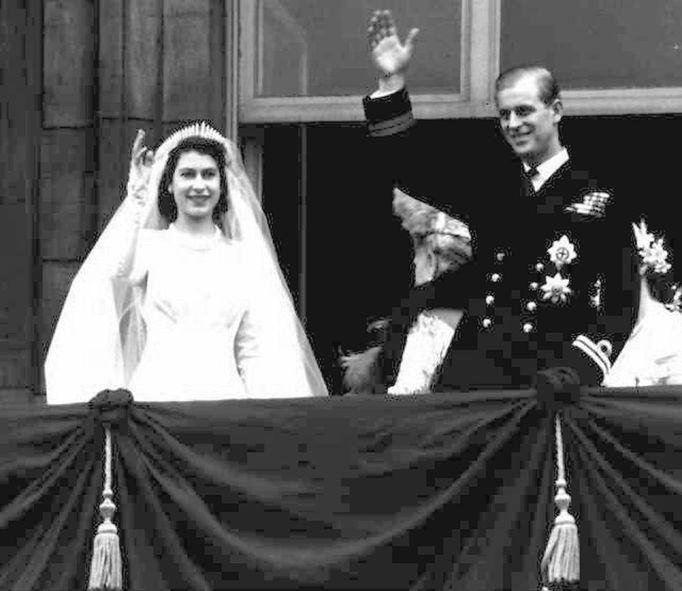 Princess Elizabeth, left, and her husband Prince Philip, wave from the balcony of London's Buckingham Palace, following their wedding, November 20, 1947