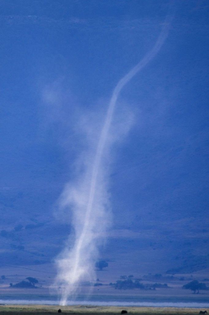 Africa Tanzania Ngorongoro Conservation Area Funnel cloud of dust formed by spiraling winds inside N Africa Tanzania Ngorongoro Conservation Area Funnel cloud of dust formed by spiraling winds inside Ngorongoro Crater