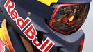 The car driven by Red Bull Racing F1 driver Daniel Ricciardo is reflected in a team members protective goggles during the first practice session at the Australian Formul