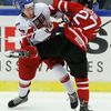 Czech Republic's Knot checks Canada's Drouin during the second period of their IIHF World Junior Championship ice hockey game in Malmo