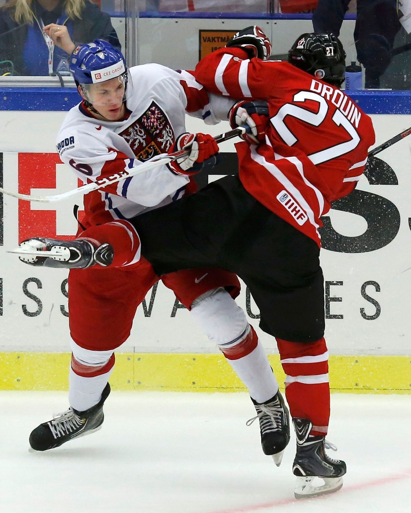 Czech Republic's Knot checks Canada's Drouin during the second period of their IIHF World Junior Championship ice hockey game in Malmo