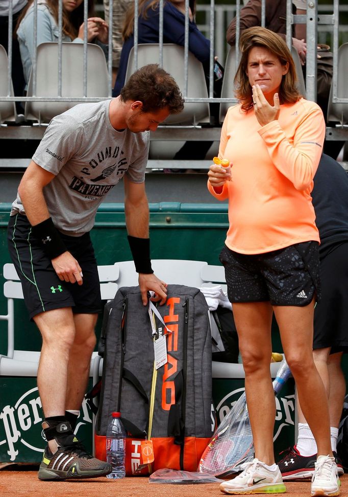 Britain's Murray listen and his coach and former tennis player Mauresmo arrive for a training session for the French Open tennis tournament at the Roland Garros stadium i