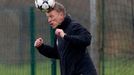 Manchester United's manager Moyes heads a ball during a training session at the club's Carrington training complex in Manchester