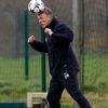 Manchester United's manager Moyes heads a ball during a training session at the club's Carrington training complex in Manchester