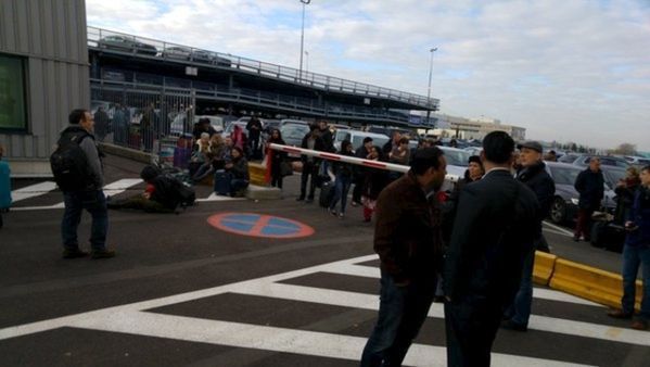 People are seen at the scene of explosions at Zaventem airport near Brussels