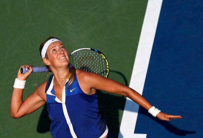 Victoria Azarenka of Belarus serves to Misaki Doi of Japan during their match at the 2014 U.S. Open tennis tournament in New York