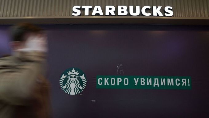 A man walks past a closed Starbucks cafe in central Saint Petersburg, Russia May 23, 2022.  REUTERS/Anton Vaganov