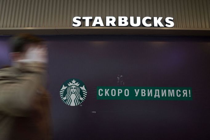 A man walks past a closed Starbucks cafe in central Saint Petersburg, Russia May 23, 2022.  REUTERS/Anton Vaganov