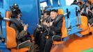 North Korean leader Kim Jong-Un prepares to take a ride with other high-level officials during the opening ceremony of the Rungna People's Pleasure Ground on Rungna Islet along the Taedong River in Pyongyang in this July 25, 2012 photograph released by the North's KCNA to Reuters on July 26, 2012.The Rungna People's Pleasure Ground has attractions such as a dolphinarium, a wading pool, a fun fair and a mini golf course, according to KCNA. REUTERS/KCNA (NORTH KOREA - Tags: POLITICS SOCIETY) FOR EDITORIAL USE ONLY. NOT FOR SALE FOR MARKETING OR ADVERTISING CAMPAIGNS. THIS IMAGE HAS BEEN SUPPLIED BY A THIRD PARTY. IT IS DISTRIBUTED, EXACTLY AS RECEIVED BY REUTERS, AS A SERVICE TO CLIENTS. NO THIRD PARTY SALES. NOT FOR USE BY REUTERS THIRD PARTY DISTRIBUTORS Published: Čec. 26, 2012, 3:50 dop.