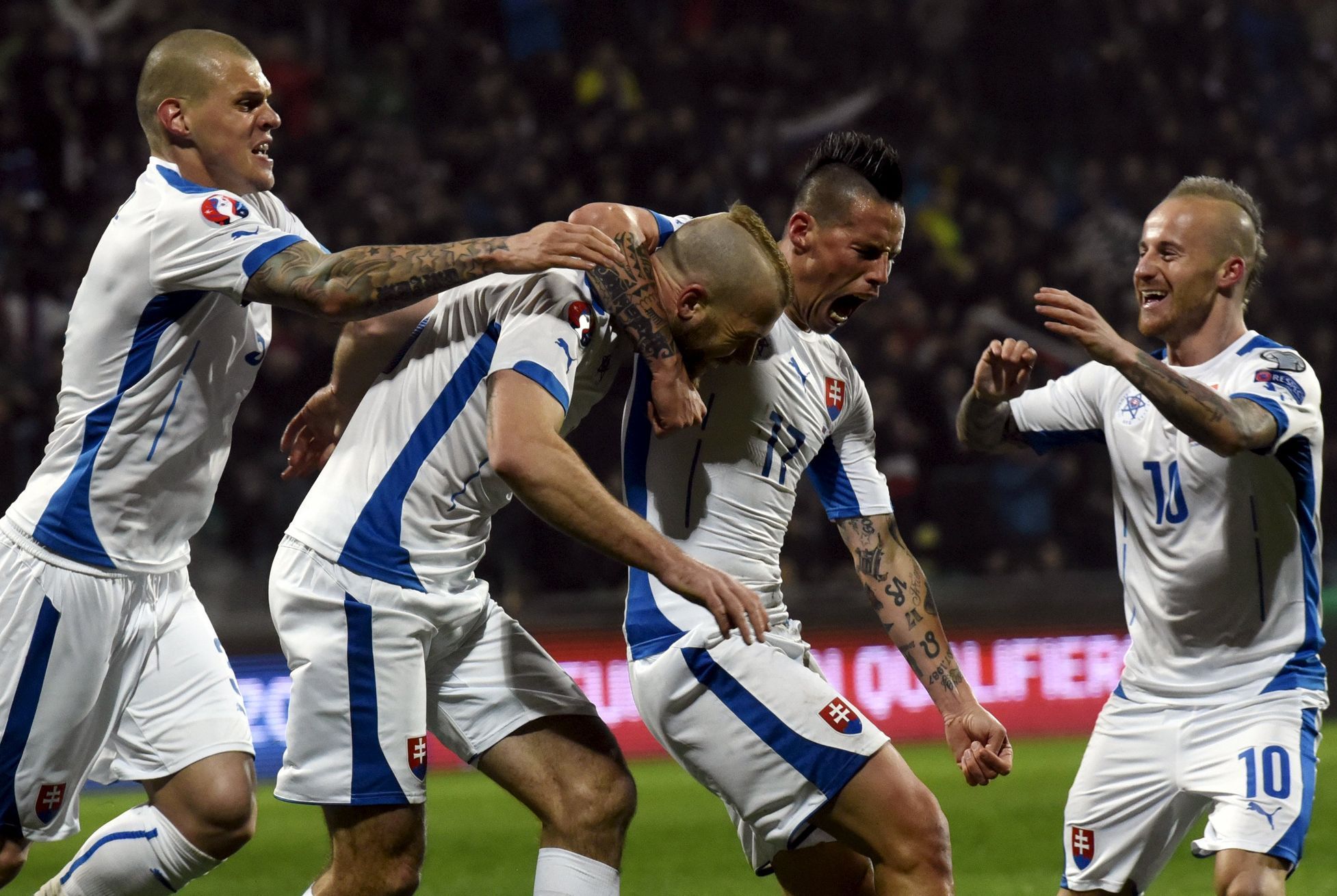 Skrtel, Nemec, Hamsik and Stoch of Slovakia celebrate their first goal against Luxembourg during their Euro 2016 qualifying soccer match in Zilina