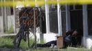 The dead body of a man is seen after he was shot by gang members in San Pedro Sula March 28, 2013. San Pedro Sula, the country's second largest city after Tegucigalpa, has a homicide rate of 169 per 100,000 people and was named the world's most violent city for a second year in a row. Lax laws allow civilians to own up to five personal guns. Arms trafficking has flooded the country with nearly 70% illegal firearms. 83.4% of homicides are by firearms, compared to 60% in the United States. Picture taken March 28, 2013. REUTERS/Jorge Cabrera (HONDURAS - Tags: CRIME LAW CIVIL UNREST HEALTH) ATTENTION EDITORS: PICTURE 31 OF 39 FOR PACKAGE 'GUN CULTURE - HONDURAS' SEARCH 'HONDURAS GUN' FOR ALL IMAGES Published: Dub. 5, 2013, 11:15 dop.