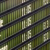 Cancelled flights by German air carrier Lufthansa are pictured on flight schedule board at Munich's airport