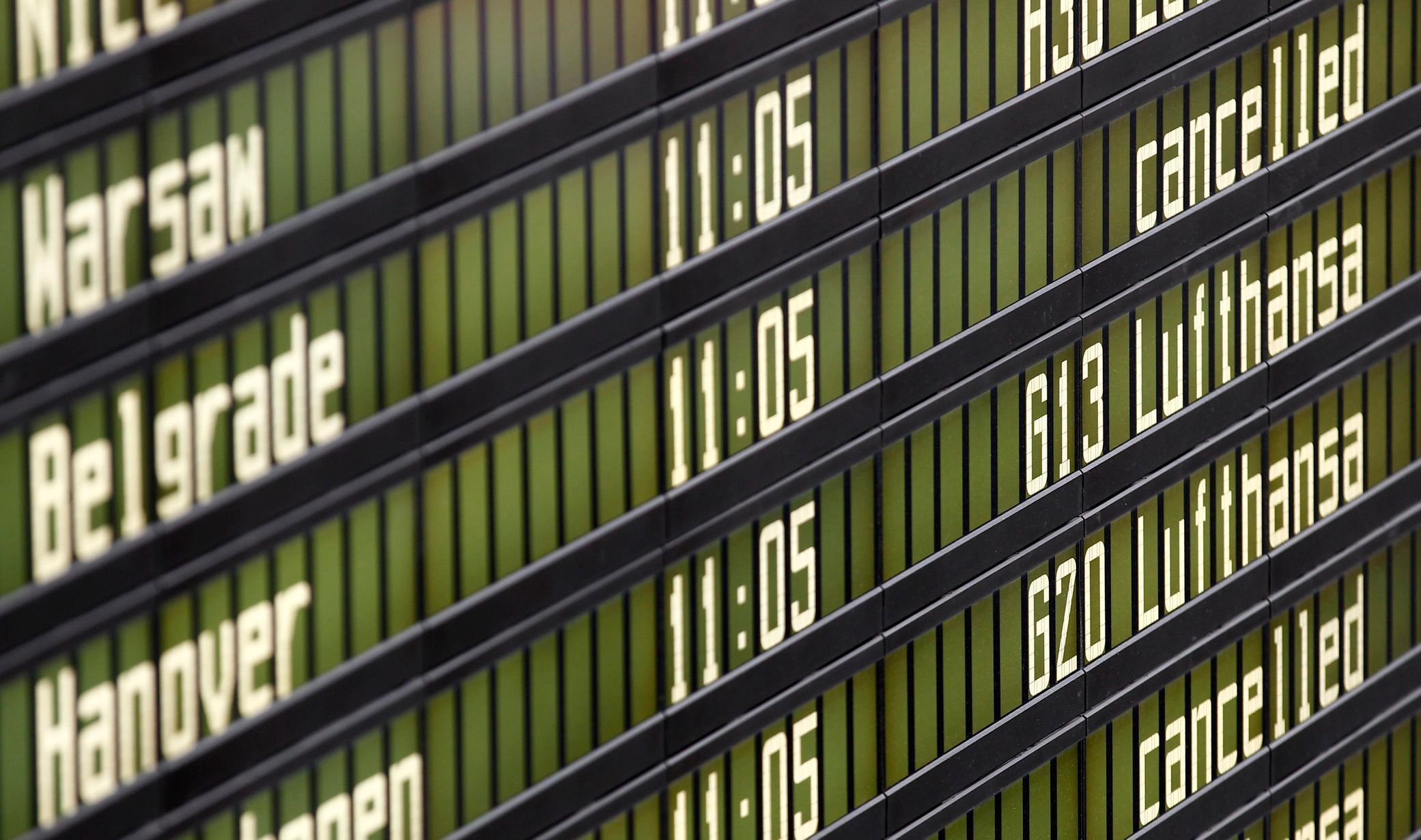 Cancelled flights by German air carrier Lufthansa are pictured on flight schedule board at Munich's airport