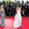 Actress Naomi Watts and an unidentified guest pose on the red carpet as they arrive for the screening of the film &quot;How to Train Your Dragon 2&quot; out of competition at the 67th Cannes Film Fest