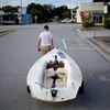 Emmett West pulls his boat from a nearby marina to secure it at his home ahead Hurricane Florence in Morehead City, N.C.
