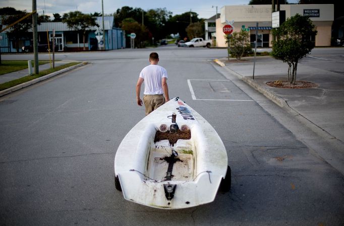 Emmett West pulls his boat from a nearby marina to secure it at his home ahead Hurricane Florence in Morehead City, N.C.