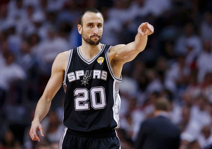 San Antonio Spurs' Manu Ginobili reacts after a basket against the Miami Heat during the second quarter in Game 7 of their NBA Finals basketball playoff in Miami, Florida