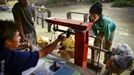 Sulfur miner having his sulfur load weighed Sulfur miners in Eastern Java's famous sulfur-belching Ijen crater rely on their sheer muscle power to mine sulfur in some of