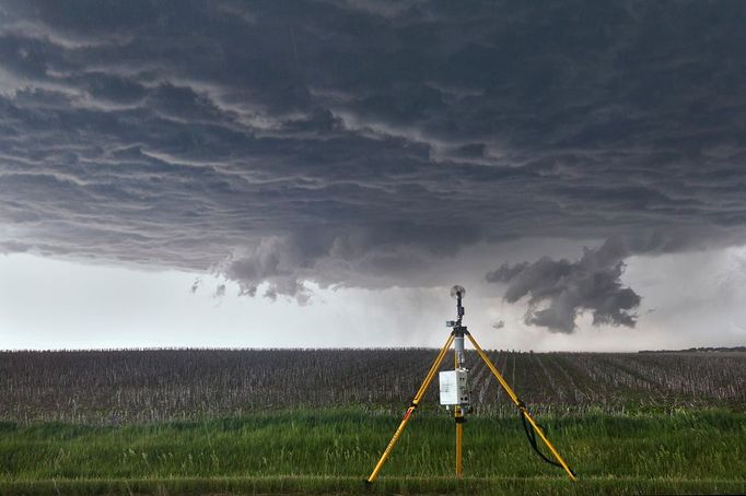 VORTEX 2 - Stick-Net Probe A portable observing station known as a "Stick-Net probe" collects high-resolution meteorological data as severe thunderstorm approaches in Nebraksa on June 6, 2010. Created by Texas Tech University, the Stick-Net is designed to be deployed very quickly by a small number of researchers and students.