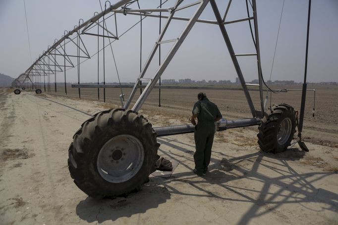 Venezuelský voják na farmě v La Placera, Maracay.