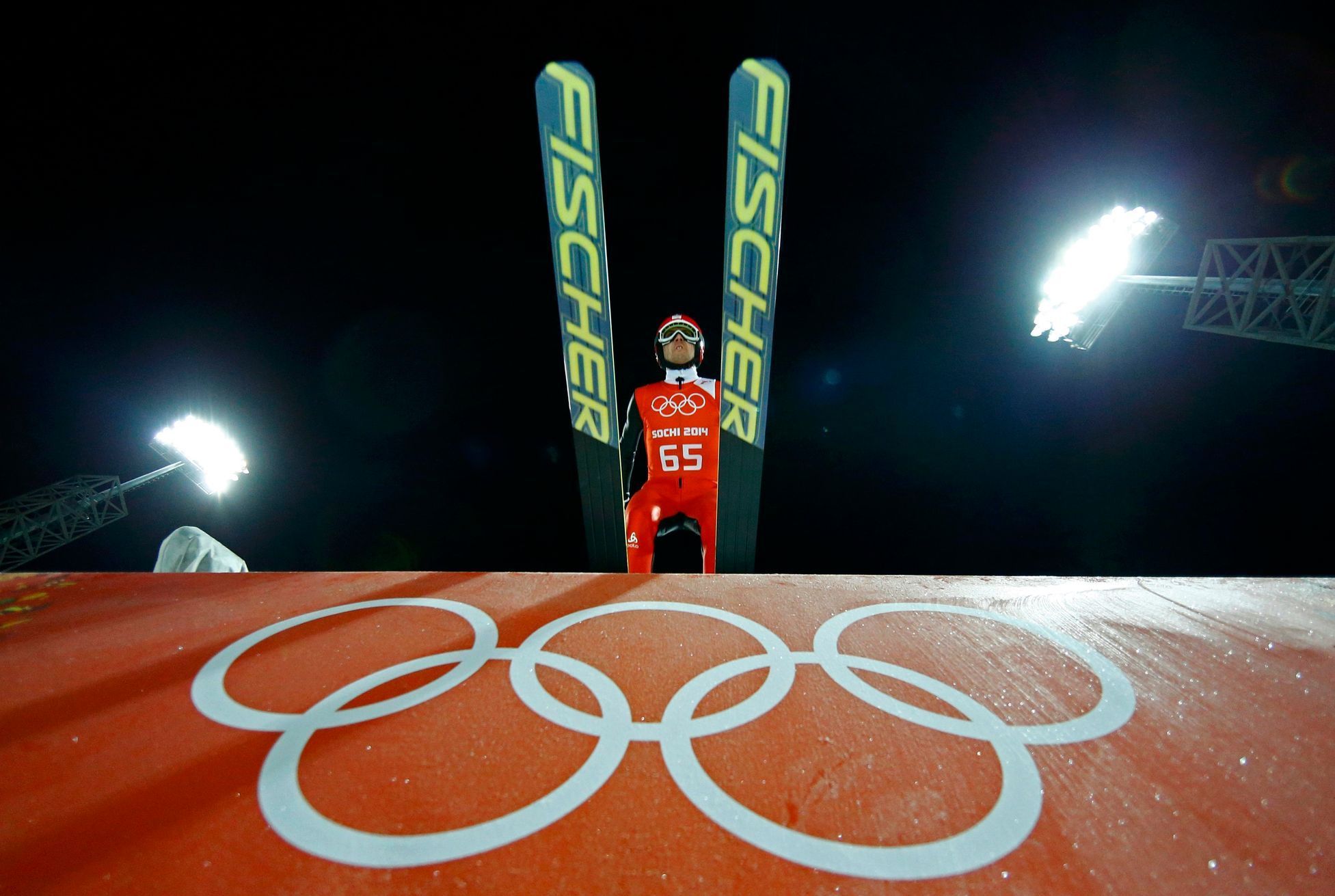 Switzerland's Ammann takes off from the ski jump during the men's ski jumping individual normal hill training event of the Sochi 2014 Winter Olympic Games in Rosa Khutor