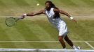 Dustin Brown of Germany hits a shot during his match against Viktor Troicki of Serbia at the Wimbledon Tennis Championships in London