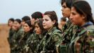 Female fighters of the Kurdish People's Protection Units (YPG) stand at attention at a military camp in Ras a-Ain January 30, 2015. Picture taken January 30, 2015.