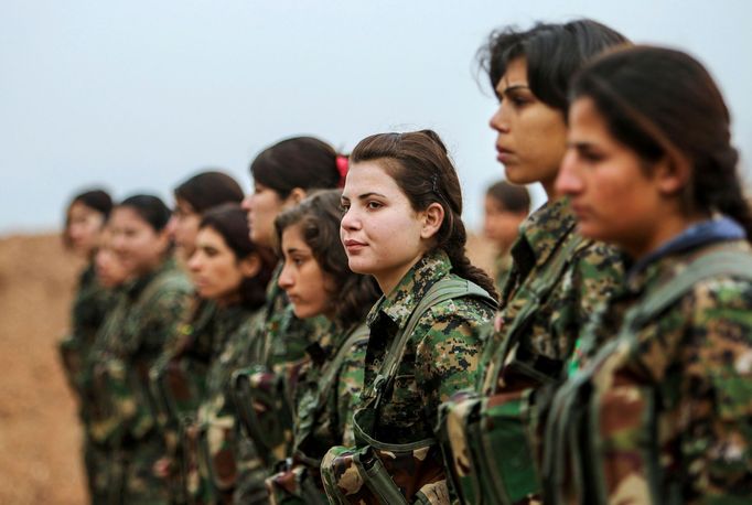 Female fighters of the Kurdish People's Protection Units (YPG) stand at attention at a military camp in Ras a-Ain January 30, 2015. Picture taken January 30, 2015.