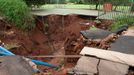 Rainfall Causes Sink Hole In Pretoria PRETORIA, SOUTH AFRICA - NOVEMBER 25: Heavy rainfall has caused a massive sinkhole on the corner of Pretorius and Shepstone on November 25, 2012 in Pretoria, South Africa.