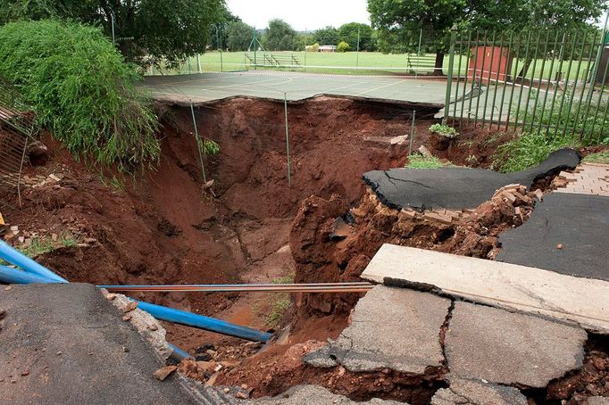 Rainfall Causes Sink Hole In Pretoria PRETORIA, SOUTH AFRICA - NOVEMBER 25: Heavy rainfall has caused a massive sinkhole on the corner of Pretorius and Shepstone on November 25, 2012 in Pretoria, South Africa.