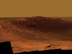 Color Panorama of 'Santa Maria' Crater for Opportunity's Anniversary NASA's Mars Exploration Rover Opportunity is spending the seventh anniversary of its landing on Mars investigating a crater called "Santa Maria," which has a diameter about the length of a football field. This scene looks eastward across the crater. Portions of the rim of a much larger crater, Endurance, appear on the horizon. The panorama spans 125 compass degrees, from north-northwest on the left to south-southwest on the right. It has been assembled from multiple frames taken by the panoramic camera (Pancam) on Opportunity during the 2,453rd and 2,454th Martian days, or sols, of the rover's work on Mars (Dec. 18 and 19, 2010). Opportunity landed in the Meridiani Planum region of Mars on Jan. 24, 2004, Universal Time (Jan. 25, Pacific Time) for a mission originally planned to last for three months. Since that prime mission, the rover has continued to work in bonus-time extended missions. Both Opportunity and its twin, Spirit, have made important discoveries about wet environments on ancient Mars that may have been favorable for supporting microbial life. By mid-January 2011, Opportunity reached a location at the southeastern edge of Santa Maria crater. The rover team developed plans for Opportunity to spend a few weeks investigating rocks at that site during solar conjunction, a period when communications between Earth and Mars are curtailed because the sun is almost directly between the two planets. After completion of its work at Santa Maria, the rover will resume a long-term trek toward Endeavour. This view combines images taken through three different Pancam filters admitting light with wavelengths centered at 753 nanometers (near infrared), 535 nanometers (green) and 432 nanometers (violet). This "natural color" is the rover team's best estimate of what the scene would look like if we were there and able to see it with our own eyes. Seams have been eliminated from the sky portion of the mosaic to better simulate the vista a person standing on Mars would see. Image Credit: NASA/JPL-Caltech/Cornell/ASU