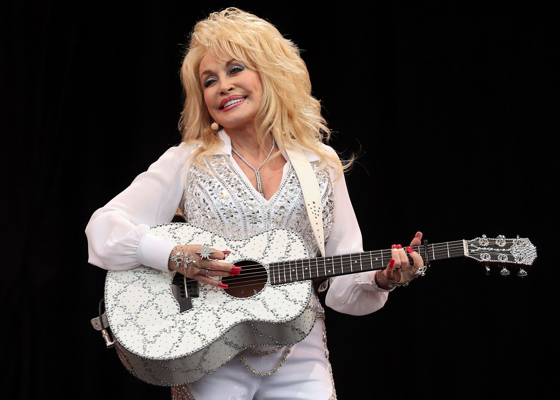 Parton performs on the Pyramid Stage at Worthy Farm in Somerset, during the Glastonbury Festival