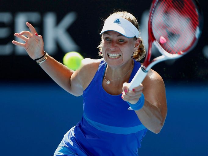 Angelique Kerber of Germany hits a return to Alla Kudryavtseva of Russia during their women's singles match at the Australian Open 2014 tennis tournament in Melbourne Jan