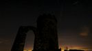 A meteor streaks across the sky during the Perseid meteor shower at Bradgate Park in Newtown Linford