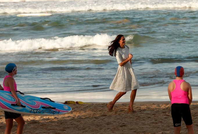 Catherine, Britain's Duchess of Cambridge, runs across Manly beach in Sydney