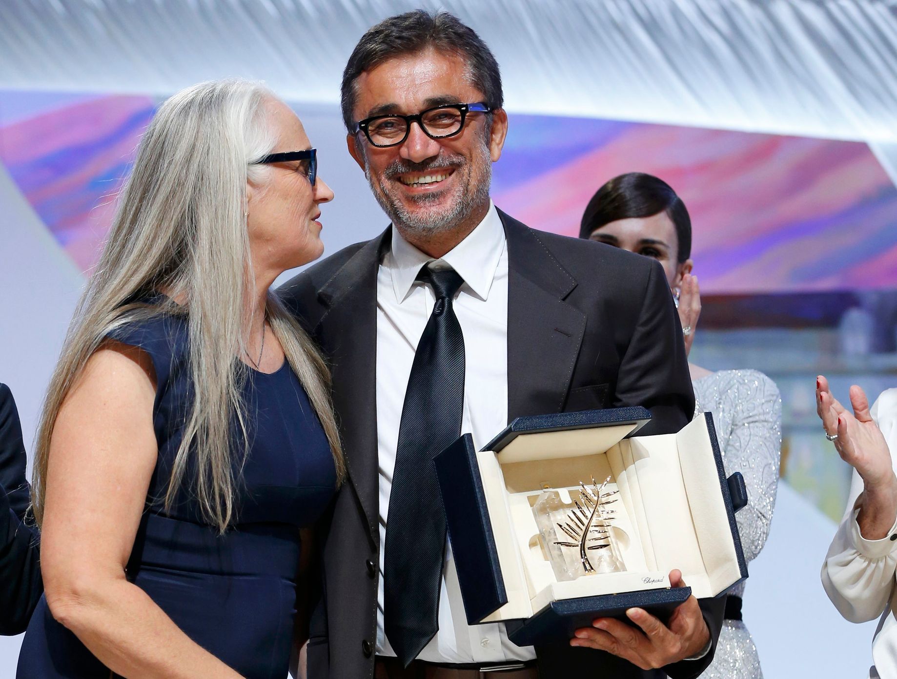 Jury President Jane Campion poses with director Nuri Bilge Ceylan, Palme d'Or award winner for his film &quot;Winter Sleep&quot;, during the closing ceremony of the 67th Cannes Film Festival in Cannes