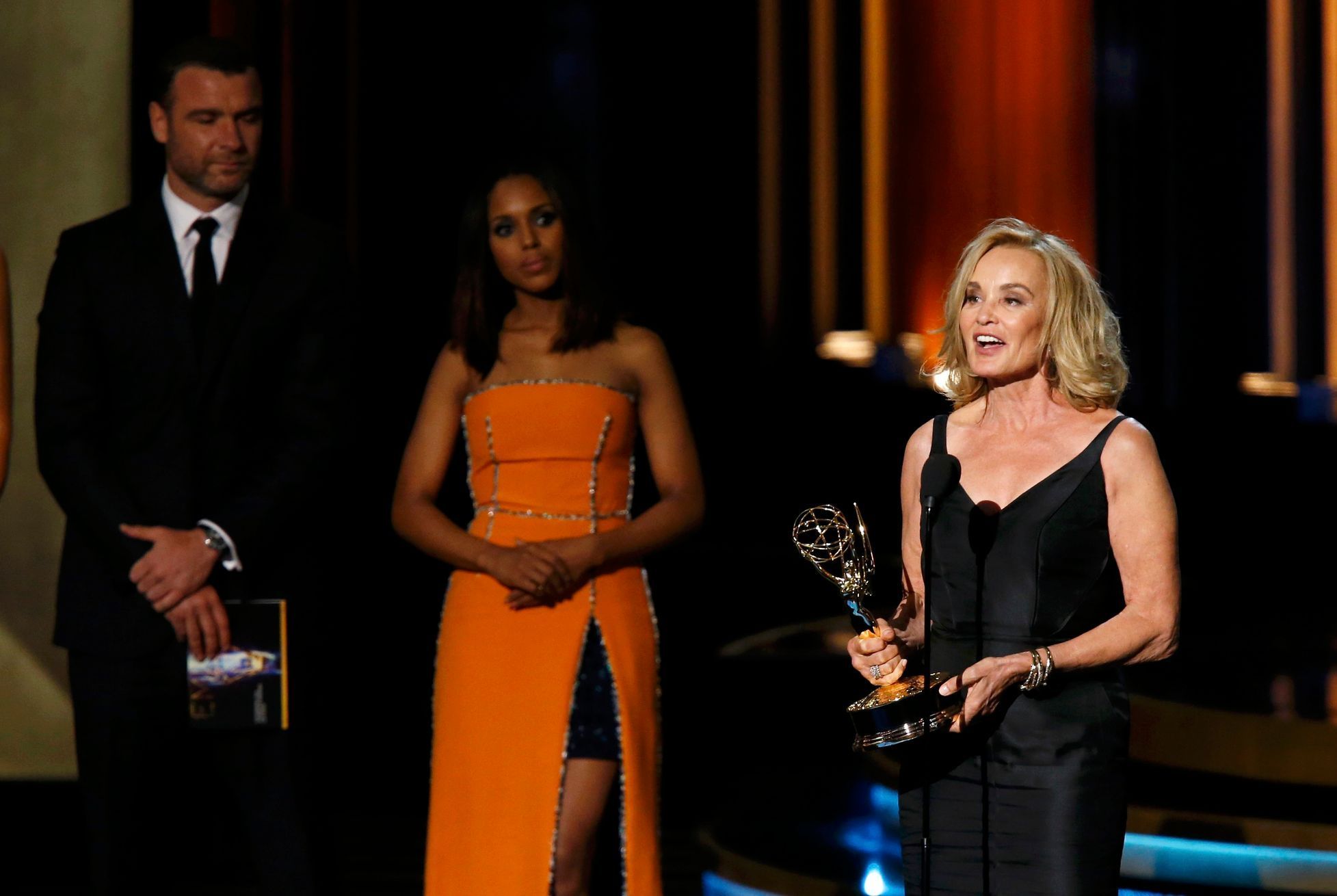 Jessica Lange accepts the award for Outstanding Lead Actress In A Miniseries Or A Movie for her role in &quot;American Horror Story: Coven&quot; as presenters Kerry Washington and Liev Schreiber look