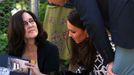 Catherine, the Duchess of Cambridge, and Britain's Prince William are shown a photo album by local resident O'Dell during a visit to the Blue Mountains suburb of Winmalee