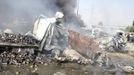 Mangled and smouldering vehicles are seen at the site of an explosion in Damascus May 10, 2012. Dozens of people were killed or wounded in two "terrorist explosions" which struck a southern district of the Syrian capital Damascus on Thursday, state television said. REUTERS/Sana/Handout (SYRIA - Tags: CIVIL UNREST POLITICS) FOR EDITORIAL USE ONLY. NOT FOR SALE FOR MARKETING OR ADVERTISING CAMPAIGNS. THIS IMAGE HAS BEEN SUPPLIED BY A THIRD PARTY. IT IS DISTRIBUTED, EXACTLY AS RECEIVED BY REUTERS, AS A SERVICE TO CLIENTS Published: Kvě. 10, 2012, 7:04 dop.