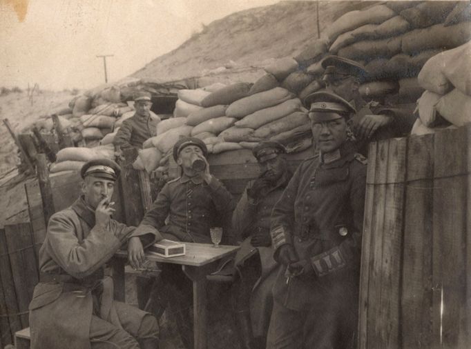 German officers sit outside dugouts on the Yser Front in Belgium in this 1917 handout picture.