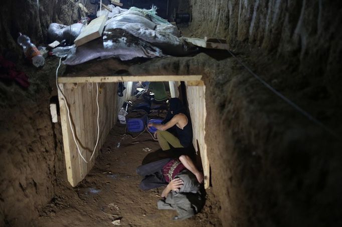 RAFAH, March 11, 2013 Palestinian workers repair a smuggling tunnel flooded by Egyptian forces beneath the Egyptian-Gaza border in Rafah in the southern Gaza Strip on March 11, 2013. The Gaza Strip's Hamas government accused Egypt last week of flooding cross-border tunnels with sewage water in order to halt a thriving smuggling trade that has helped prop up the local economy for more than five years.