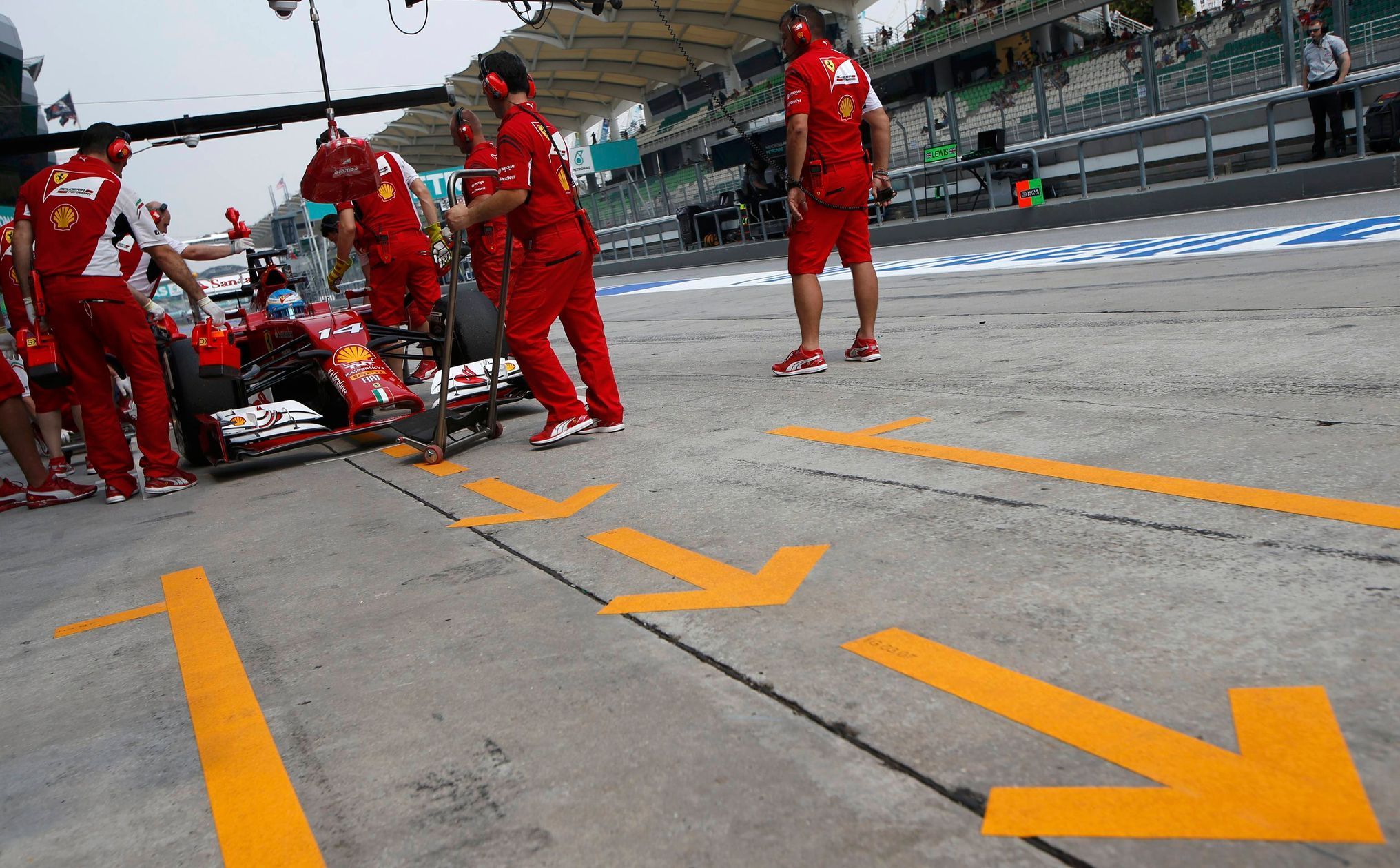 Ferrari Formula One driver Alonso of Spain pits during the second practice session of the Malaysian F1 Grand Prix at Sepang International Circuit outside Kuala Lumpur