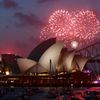 Fireworks light up the Sydney Opera House during an early light show before the new year