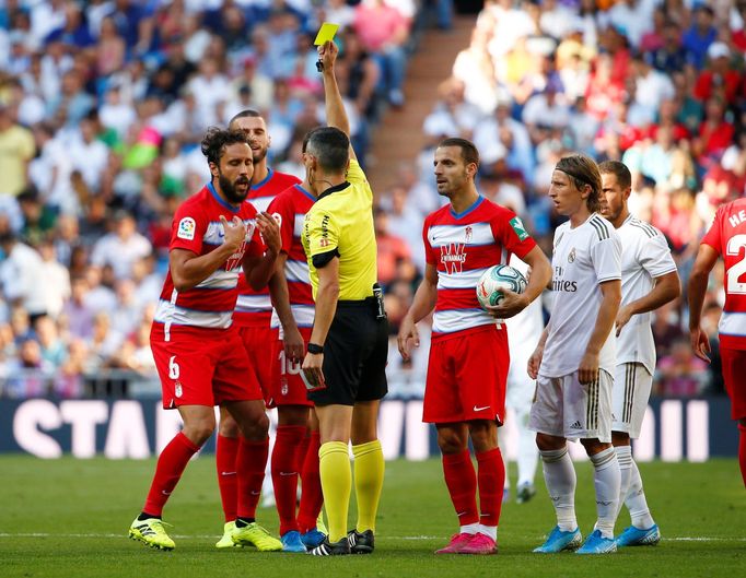 Soccer Football - La Liga Santander - Real Madrid v Granada - Santiago Bernabeu, Madrid, Spain - October 5, 2019  Granada's German is shown a yellow card by referee Santi