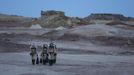 Members of Crew 125 EuroMoonMars B mission return after collecting geologic samples for study at the Mars Desert Research Station (MDRS) in the Utah desert March 2, 2013. The MDRS aims to investigate the feasibility of a human exploration of Mars and uses the Utah desert's Mars-like terrain to simulate working conditions on the red planet. Scientists, students and enthusiasts work together developing field tactics and studying the terrain. All outdoor exploration is done wearing simulated spacesuits and carrying air supply packs and crews live together in a small communication base with limited amounts of electricity, food, oxygen and water. Everything needed to survive must be produced, fixed and replaced on site. Picture taken March 2, 2013. REUTERS/Jim Urquhart (UNITED STATES - Tags: SCIENCE TECHNOLOGY SOCIETY ENVIRONMENT) ATTENTION EDITORS: PICTURE 27 OF 31 FOR PACKAGE 'MARS IN THE DESERT' SEARCH 'JIM MARS' FOR ALL IMAGES Published: Bře. 11, 2013, 2:08 odp.