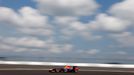 Red Bull Formula One driver Sebastian Vettel of Germany drives under a blue sky and white clouds during the third practice session of the German F1 Grand Prix at the Nuer